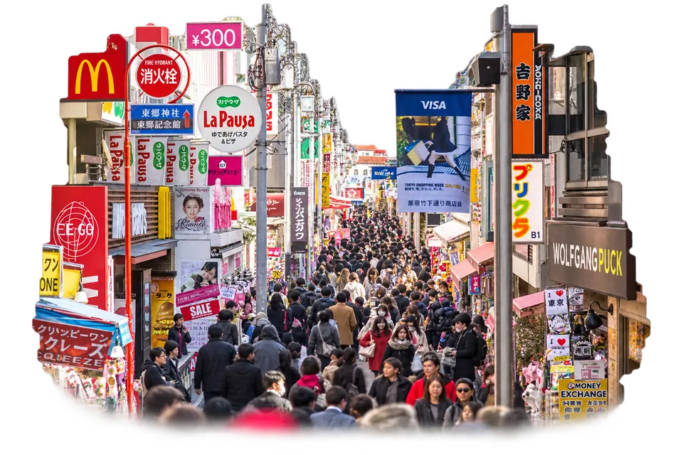 Shops, signs, and crowds along Takeshita Street in Harajuku.