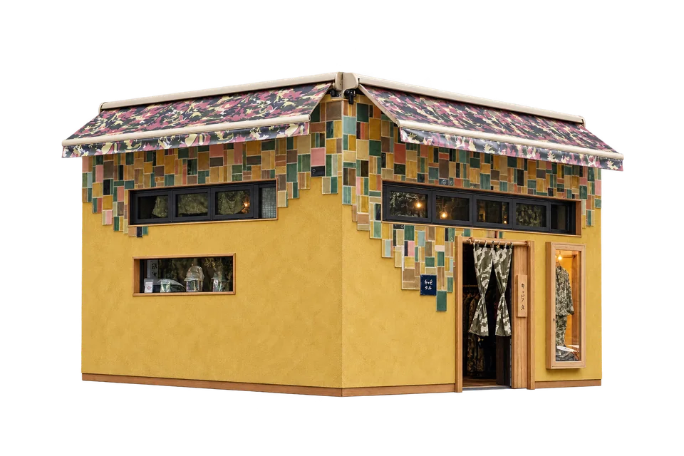 A dimensional architectural illustration of KAPITAL Ebisu’s mustard-yellow corner shop, handmade ceramic tiles and camouflage awnings.