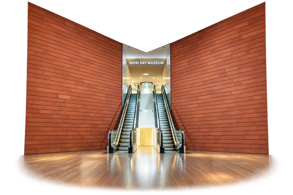 The wood-lined central atrium and escalator at Mori Art Museum in Roppongi Hills.