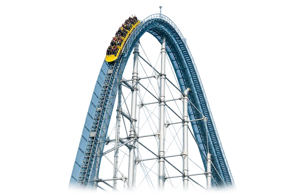 A Thunder Dolphin train tipping over the steep first drop at Tokyo Dome City.